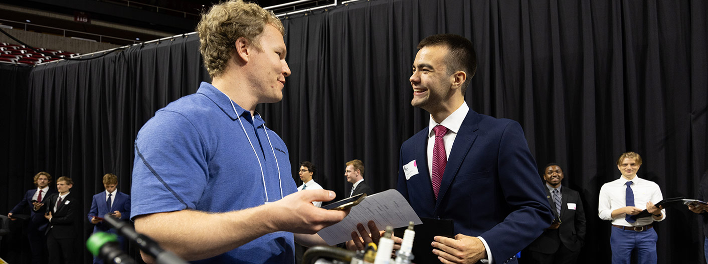 career fair interaction between employer and student