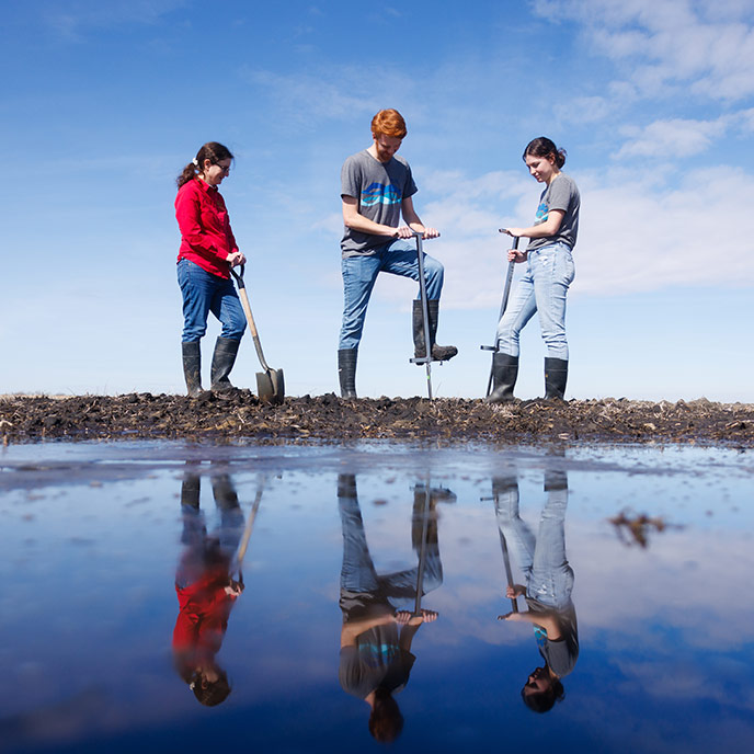 faculty and students take field soil samples