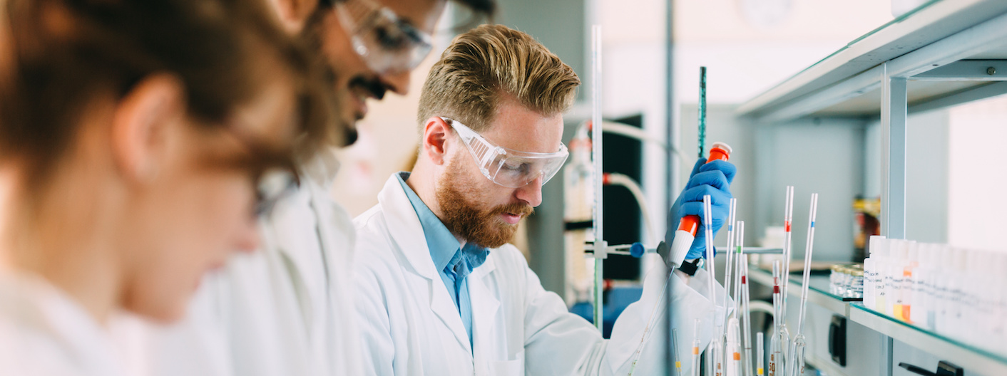Group of chemistry students working together in laboratory